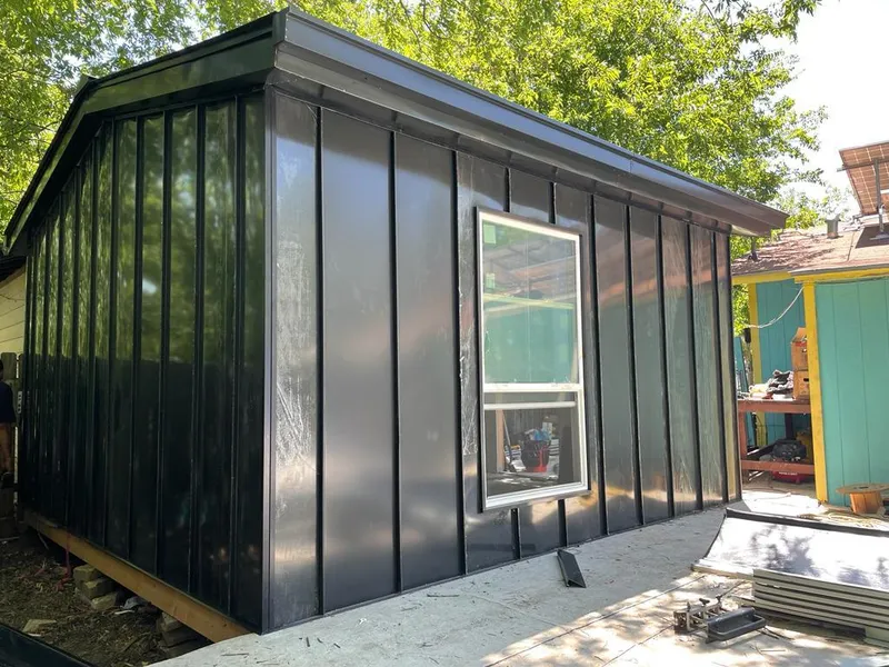 Black standing seam metal wall panels for Roof Inspection in Osprey